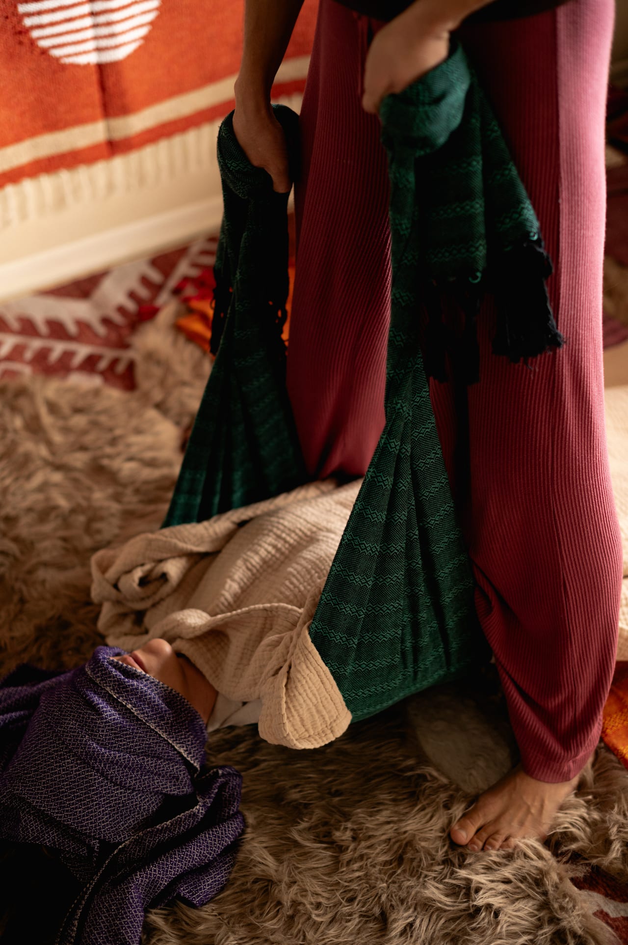 Rebozo textiles layered in a calm ceremonial setting