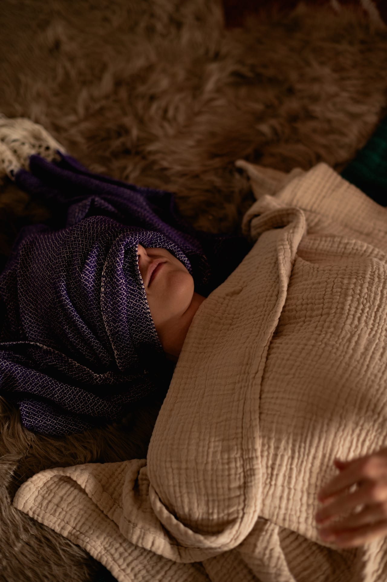 Postpartum care space with warm blankets and rebozo shawls