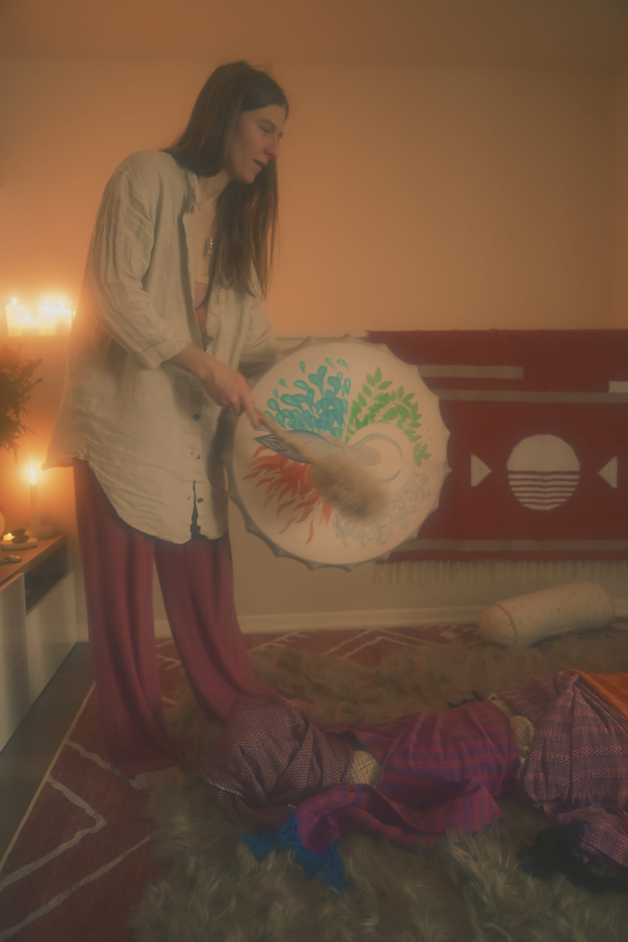 Sound healing instruments arranged on ceremonial textiles